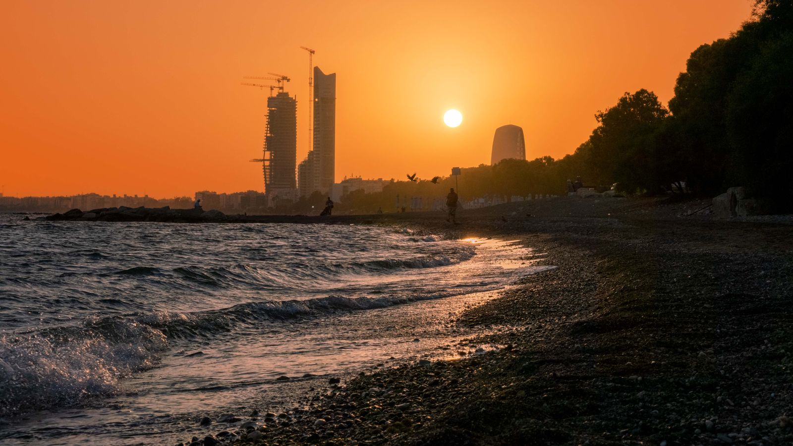 Sunset over the beach and skyline of Limassol, Cyprus