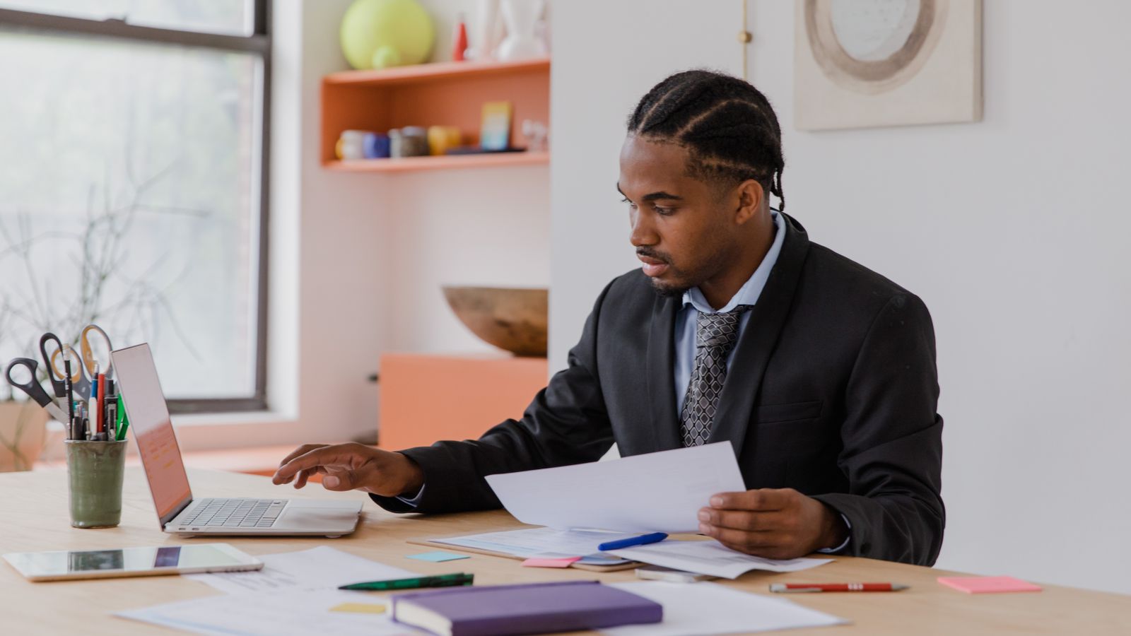 Business owner working through registration paperwork on a laptop