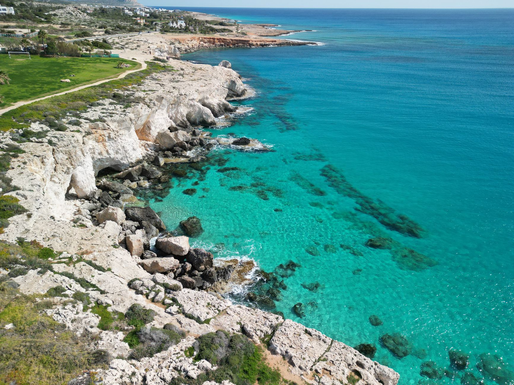 Aerial view of the rocky coastline and clear turquoise sea at Ayia Napa on the eastern tip of Cyprus